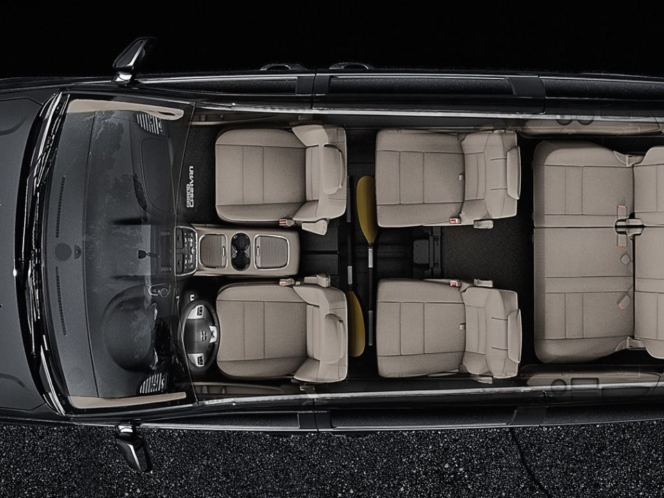 a toaster oven sitting on top of a suitcase