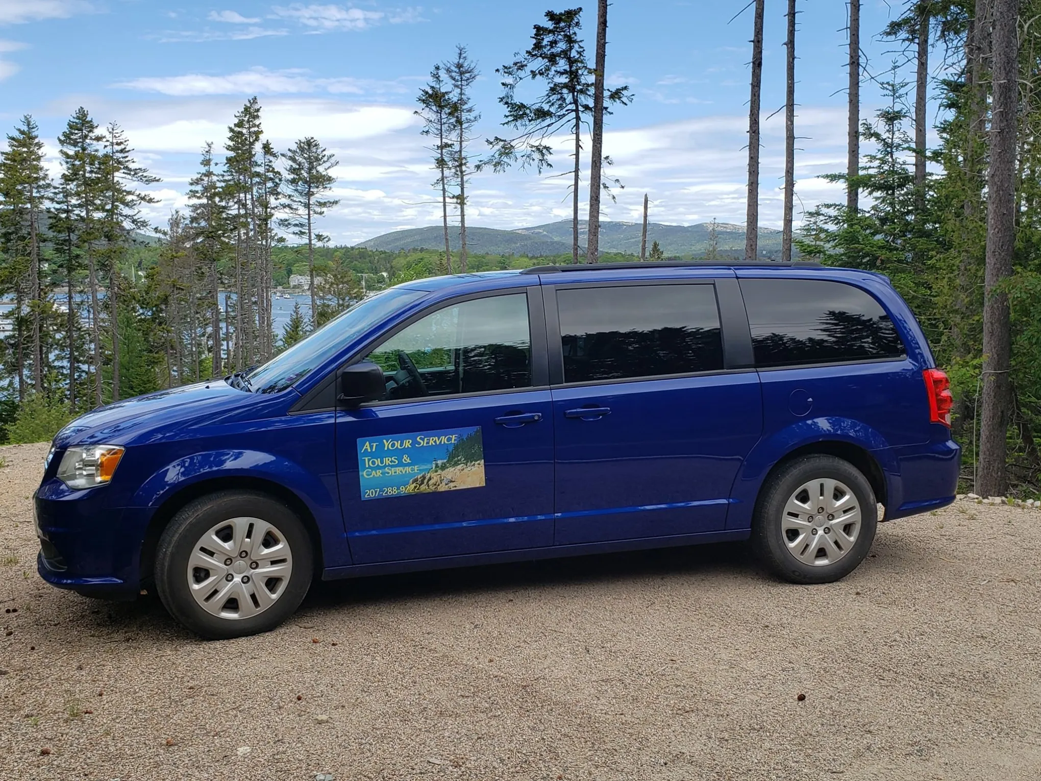 a blue car parked in a parking lot