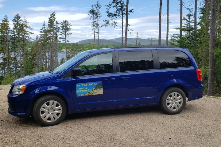 a blue car parked in a parking lot