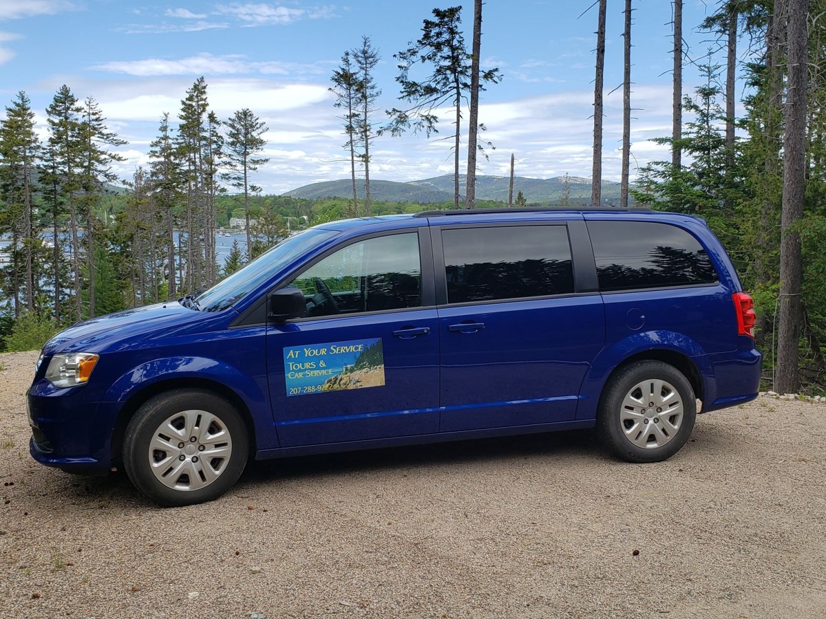 a blue car parked in a parking lot